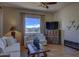 Cozy living room featuring plush sofas, decorative accents, and an entertainment center for relaxation and enjoyment at 31107 N 164Th St, Scottsdale, AZ 85262