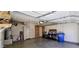 Spacious two-car garage with ample storage space, a water heater, and workbench area at 3113 E Danbury Rd # 5, Phoenix, AZ 85032