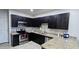 This kitchen features dark wood cabinets, granite countertops, and stainless steel appliances at 3113 E Danbury Rd # 5, Phoenix, AZ 85032
