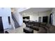 Open living room and kitchen area featuring a sofa and staircase at 3113 E Danbury Rd # 5, Phoenix, AZ 85032