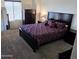 Cozy bedroom with dark wood furnishings and carpeted floor at 3113 E Danbury Rd # 5, Phoenix, AZ 85032