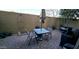 Paver patio featuring outdoor seating, an umbrella, and outdoor cooking area at 3113 E Danbury Rd # 5, Phoenix, AZ 85032