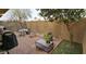 Cozy brick patio with outdoor seating, lush plants, and a barbecue grill at 3113 E Danbury Rd # 5, Phoenix, AZ 85032