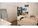 Bedroom featuring bookshelves and a full-length mirror at 3701 S Wickiup Rd, Apache Junction, AZ 85119