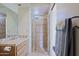 Bathroom featuring vanity with sink and a tile surround shower at 39424 N Spur Cross Rd, Cave Creek, AZ 85331