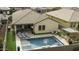 Aerial view of a backyard featuring a pool, hot tub, and outdoor seating area at 41262 W Almira Dr, Maricopa, AZ 85138