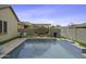 Stunning pool with basketball hoop feature, complemented by a pergola and landscaped surroundings at 41262 W Almira Dr, Maricopa, AZ 85138