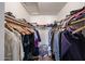 Walk-in closet with clothing racks and a variety of organized apparel at 4202 E San Gabriel Ave, Phoenix, AZ 85044