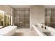 Modern bathroom featuring a soaking tub, glass-enclosed shower, and double sink vanity at 4232 E Upper Ridge Way, Paradise Valley, AZ 85253