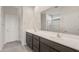 Bathroom with double sink vanity, and a glass-enclosed shower at 42860 W Palo Abeto Dr, Maricopa, AZ 85138