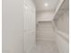 Walk-in closet with white walls and shelving at 42860 W Palo Abeto Dr, Maricopa, AZ 85138