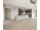 Beautiful modern kitchen with a granite island and stainless steel appliances at 42860 W Palo Abeto Dr, Maricopa, AZ 85138