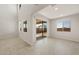 Bright, airy living room with tile floors and sliding glass doors leading to the backyard at 42860 W Palo Abeto Dr, Maricopa, AZ 85138
