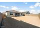 Large backyard with potential for landscaping and outdoor living space at 42965 W Palo Abeto Dr, Maricopa, AZ 85138