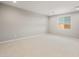 Spacious bedroom with neutral carpet, and a window bringing in natural light at 42965 W Palo Abeto Dr, Maricopa, AZ 85138