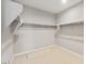 Bright walk-in closet features multiple shelves and ample storage space at 42965 W Palo Abeto Dr, Maricopa, AZ 85138