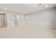 Neutral colored bedroom with carpet, window, and an open entryway at 42965 W Palo Abeto Dr, Maricopa, AZ 85138