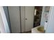 Bathroom with a toilet, sink, cabinet, and shelving unit for towels and toiletries at 44 S Hawes Rd # C13, Mesa, AZ 85208
