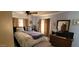 Calming bedroom with comfortable bedding, ceiling fan, and dresser at 44 S Hawes Rd # C13, Mesa, AZ 85208
