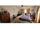 Relaxing bedroom with soft lighting, neutral colors, and dresser at 44 S Hawes Rd # C13, Mesa, AZ 85208