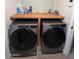 Modern laundry room with front load washer and dryer set on top of a shelf at 4435 E Badger Way, Phoenix, AZ 85044