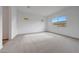 Light-filled bedroom with soft carpet, neutral walls, and ample natural light at 44729 N 44Th Dr, Phoenix, AZ 85087