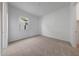 Bedroom featuring neutral carpet and walls and a window providing natural light at 44729 N 44Th Dr, Phoenix, AZ 85087