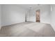 Bright bedroom with neutral carpet and an ensuite bathroom for added convenience at 44729 N 44Th Dr, Phoenix, AZ 85087