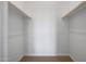 Walk-in closet with carpet flooring and dual rods for ample hanging space at 44729 N 44Th Dr, Phoenix, AZ 85087