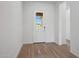 A white front door bringing in ample sunlight at 44729 N 44Th Dr, Phoenix, AZ 85087