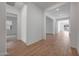 Bright hallway featuring wood-look tile flooring and neutral paint throughout at 44729 N 44Th Dr, Phoenix, AZ 85087