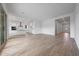 Open-plan living space showcasing wood look tile and a modern kitchen at 44729 N 44Th Dr, Phoenix, AZ 85087
