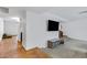 Bright living area featuring tile floors, a TV, and a neutral color palette at 4612 S Dorsey Ln, Tempe, AZ 85282