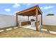 Outdoor kitchen and bar featuring a built-in grill, sink, bar seating and drought tolerant landscaping at 4612 S Dorsey Ln, Tempe, AZ 85282