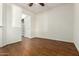 This bedroom features laminate floors, a ceiling fan and a closet at 501 W Hononegh Dr # 2, Phoenix, AZ 85027