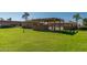 Exterior shot of a large community pool surrounded by a well-maintained lawn at 501 W Hononegh Dr # 2, Phoenix, AZ 85027