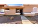 Welcoming front entrance with a red tile roof, desert landscaping, and tan stucco exterior at 501 W Hononegh Dr # 2, Phoenix, AZ 85027