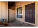 Cozy front porch with a security screen door, small window, and outdoor lighting at 501 W Hononegh Dr # 2, Phoenix, AZ 85027