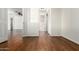 This open hallway has laminate flooring and leads to several rooms at 501 W Hononegh Dr # 2, Phoenix, AZ 85027