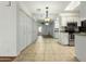 An open floor plan with a mirrored wall showcasing the kitchen and living room at 501 W Hononegh Dr # 2, Phoenix, AZ 85027