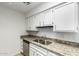 Bright kitchen features granite countertops, stainless steel dishwasher, and white cabinets at 501 W Hononegh Dr # 2, Phoenix, AZ 85027