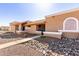 A pleasant street view of homes with stucco exteriors and desert landscaping at 501 W Hononegh Dr # 2, Phoenix, AZ 85027