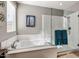 This bathroom features a soaking tub and a glass enclosed shower at 5054 S Advant Ter, Mesa, AZ 85212