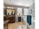 This primary bathroom features double sinks, a large soaking tub, and a walk-in shower at 5054 S Advant Ter, Mesa, AZ 85212