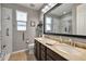 This bathroom features a large vanity with double sinks and a walk-in shower at 5054 S Advant Ter, Mesa, AZ 85212