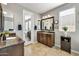This bathroom features double sinks with granite countertops and tile flooring at 5054 S Advant Ter, Mesa, AZ 85212