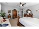 This bedroom features elegant, wood furniture and neutral-toned walls at 5054 S Advant Ter, Mesa, AZ 85212