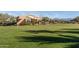 Expansive community park featuring well-maintained grassy areas, trees, and an attractive outdoor stage at 5054 S Advant Ter, Mesa, AZ 85212