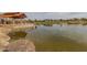 Scenic pond in the community, with stone accents, walking paths, and open green spaces at 5054 S Advant Ter, Mesa, AZ 85212