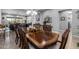 A traditional dining room showcases a large wooden table and chairs adjacent to the living area at 5054 S Advant Ter, Mesa, AZ 85212